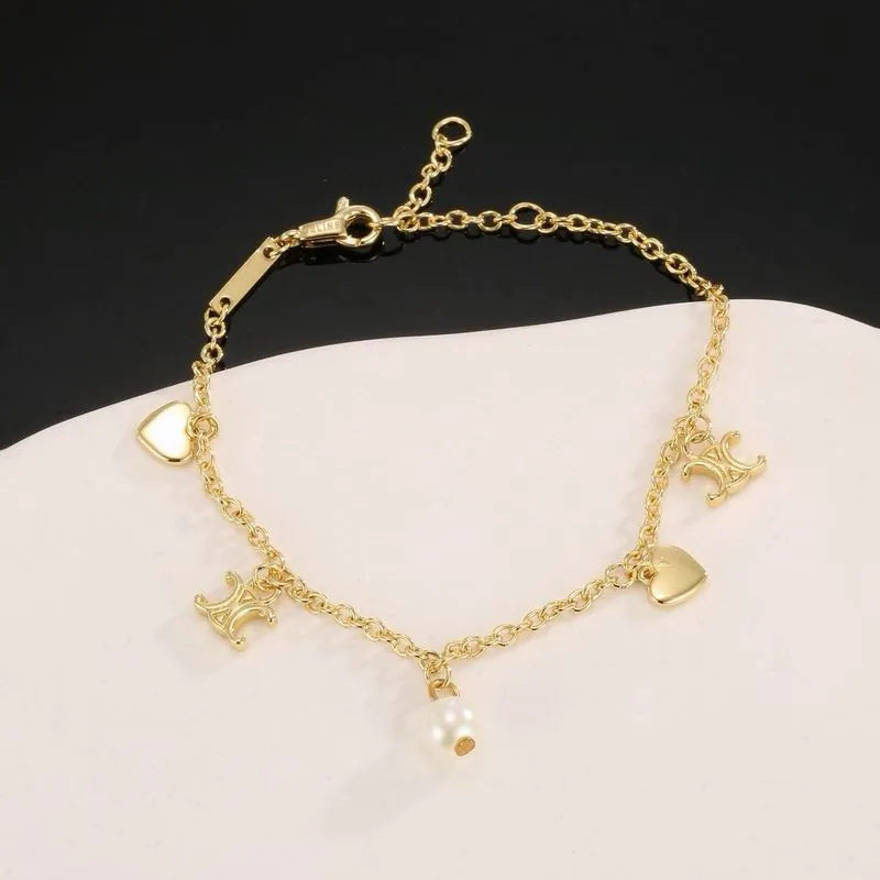 Celine gold-tone bracelet with multiple charms, catalog view 2, 07yxs06
