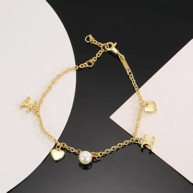 Celine gold-tone bracelet with multiple charms, catalog view 3, 07yxs06