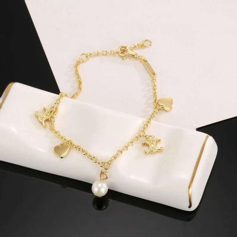 Celine gold-tone bracelet with multiple charms, catalog view 4, 07yxs06