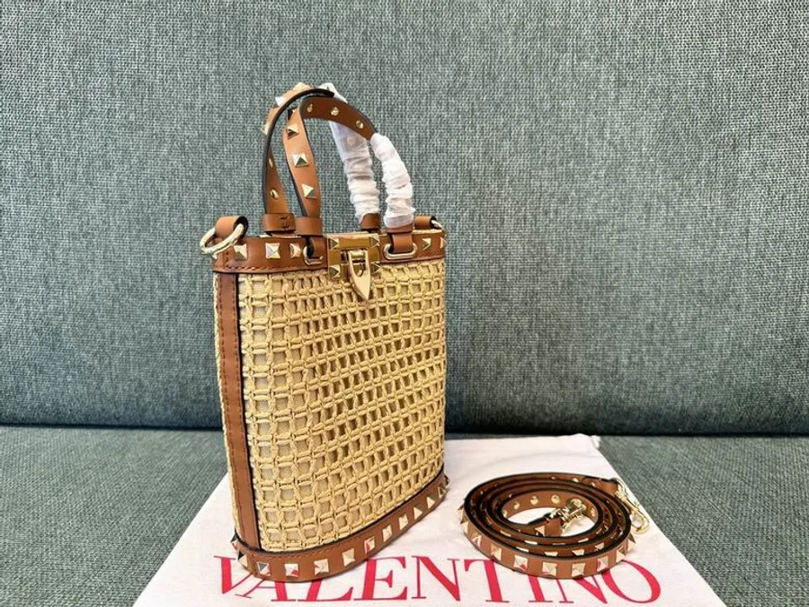 Valentino 2044 Natural Woven Bucket Bag compact natural woven bucket bag with top handle, trim, and strap shown view 2