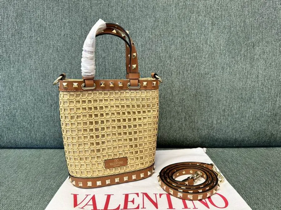 Valentino 2044 Natural Woven Bucket Bag compact natural woven bucket bag with top handle, trim, and strap shown view 3