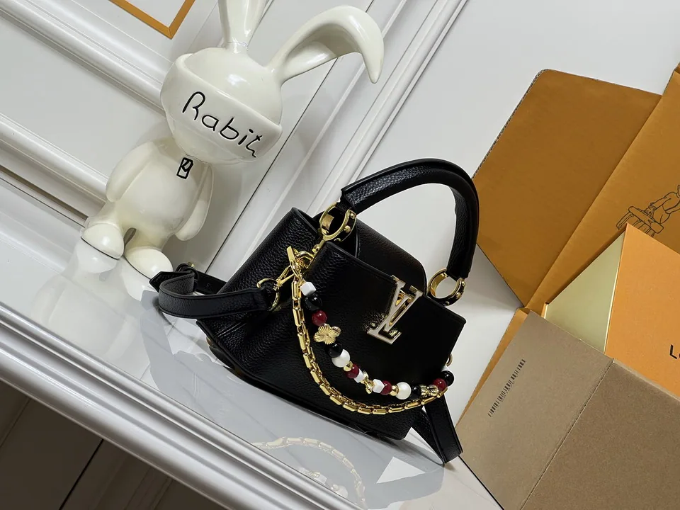 LV black top-handle bag with decorative charm chain, catalog view 2, M29443