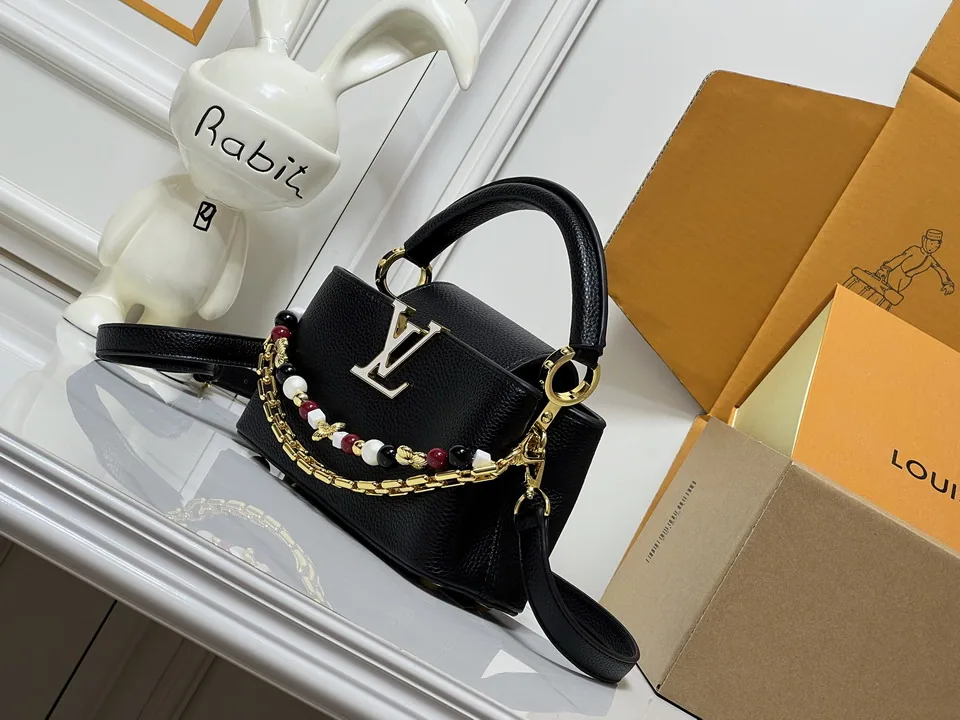 LV black top-handle bag with decorative charm chain, catalog view 3, M29443