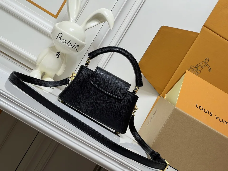 LV black top-handle bag with decorative charm chain, catalog view 4, M29443