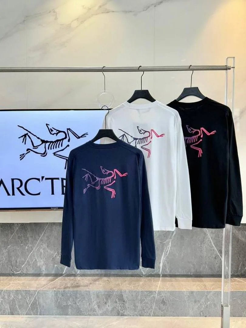 White dark and navy Arcteryx graphic tops grouped hanger view hgntx26048