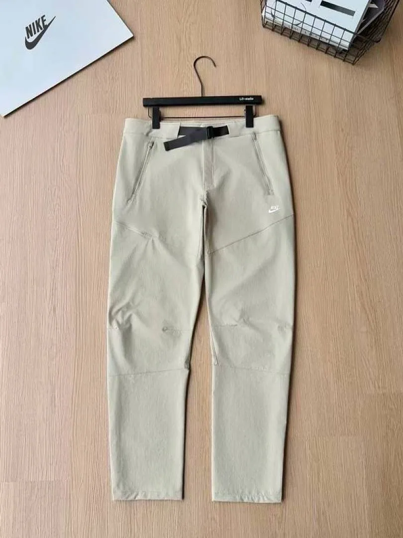 Nike cream tapered pants front flat product view hgntx43