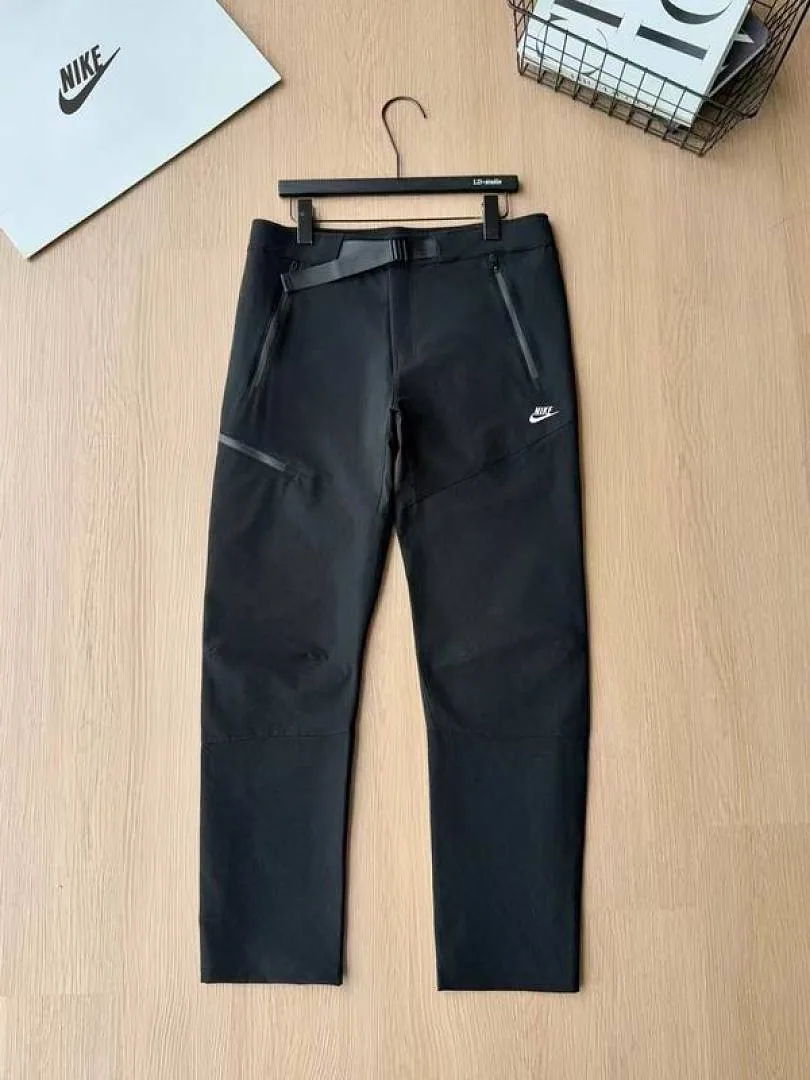 Nike black tapered pants front product view hgntx43