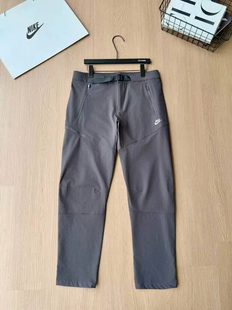 Nike grey tapered pants front product view hgntx43