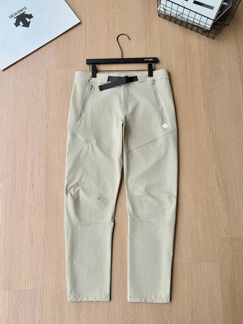 Descente cream tapered pants front product view hgntx54