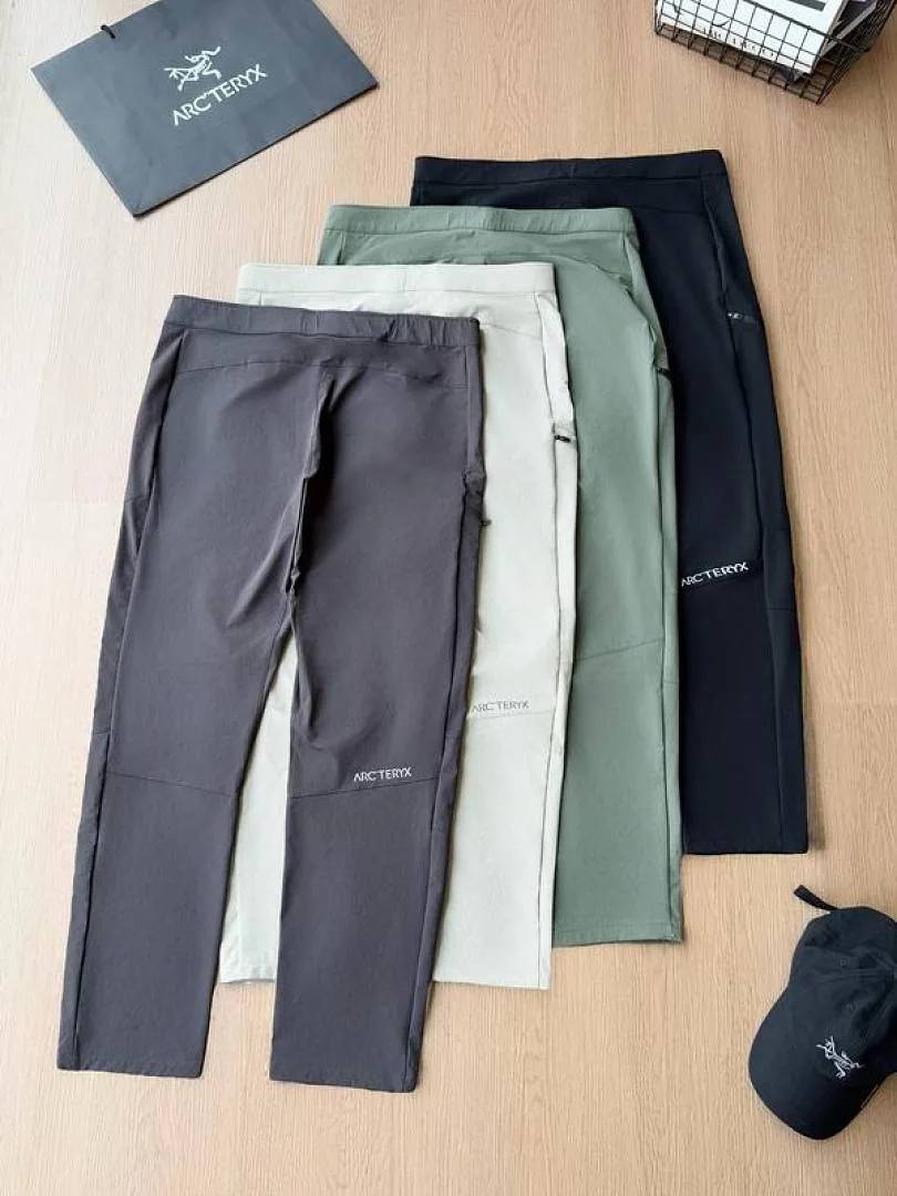 Grey green and black Arcteryx tapered pants stacked comparison hgntx71