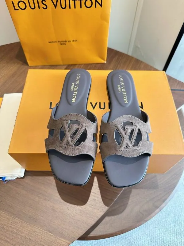 Brown slide sandals shown as a pair in the shoes edit