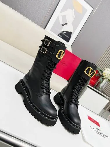 Valentino MNH0801 Black V-Detail Tall Boots black tall lace-up boots with lug sole and gold-tone V-detail on the shaft view 3