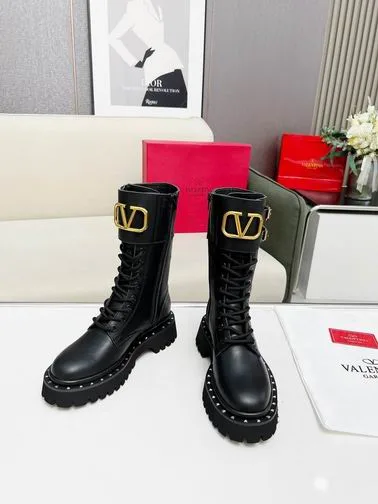 Valentino MNH0801 Black V-Detail Tall Boots black tall lace-up boots with lug sole and gold-tone V-detail on the shaft view 4