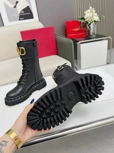 Valentino MNH0801 Black V-Detail Tall Boots black tall lace-up boots with lug sole and gold-tone V-detail on the shaft view 5