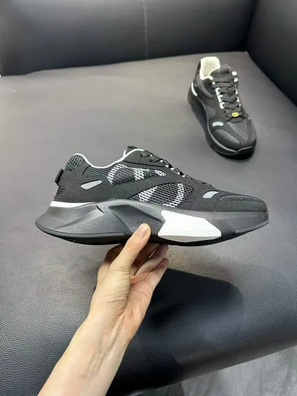 Valentino HNX0501 Grey Runner Sneakers grey runner-style sneakers with layered panels, sculpted sole, and lace-up front view 5