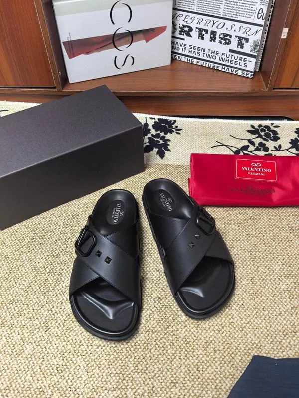 Valentino MNS0601 Black Slide Sandals black open-toe slide sandals with wide upper band and flat sandal stance view 1