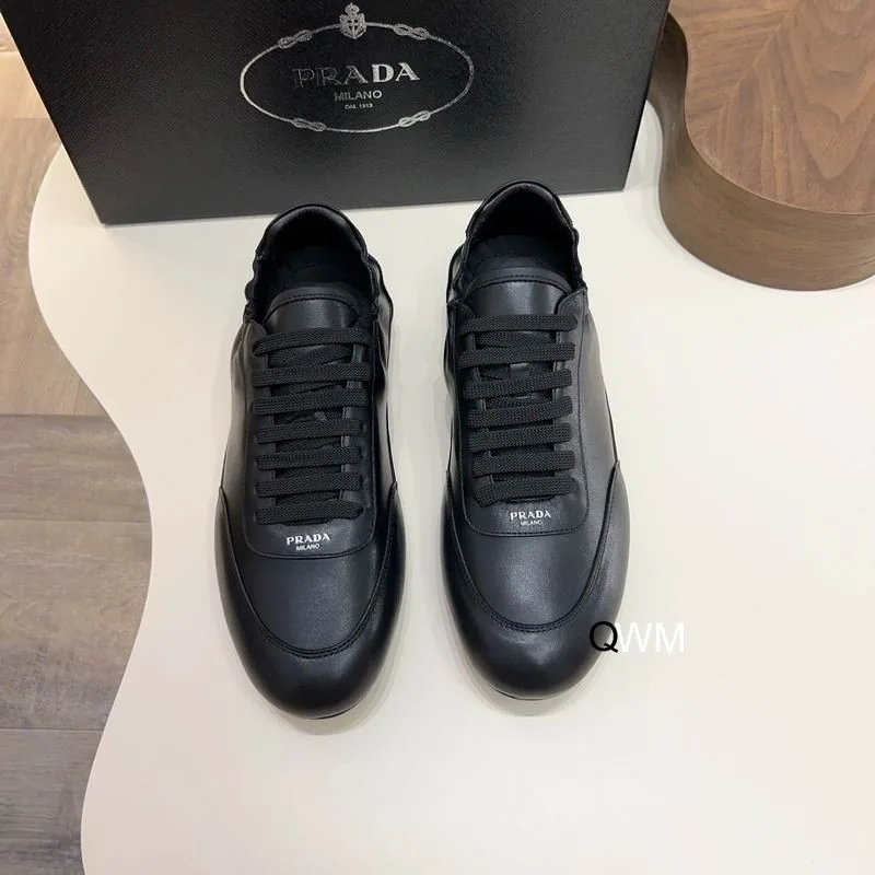 Black low-profile sneakers shown from the front for the shoes collection